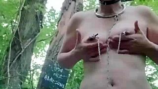 Female slave bound as ponygirl in forest outdoors
