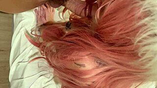 Straight-Jacket Babe With Pink Hair Gives Submissive Blowjob.