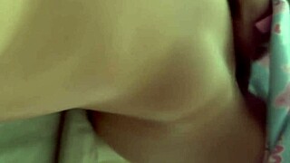 Latina uses dildo while watching porn