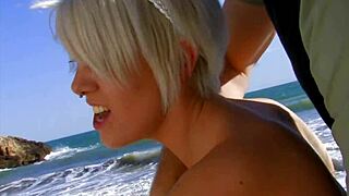 Blonde tattooed mom rides huge cock on beach