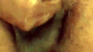 Kennesaw gives sloppy handjob to big black cock in detailed close-up