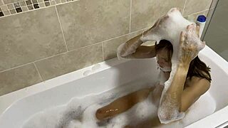 Milf sings while bathing in the bathroom