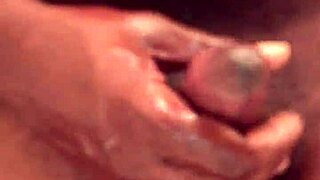 Kennesaw gives sloppy handjob to big black cock in detailed close-up