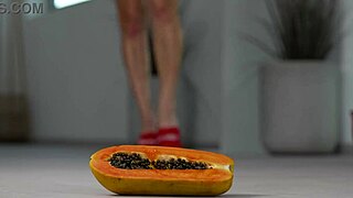 Petite girl crushes fruits with high heels in footfetish video