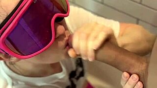 In the bathroom, he flashes his dick and cums on her face during the adventure.