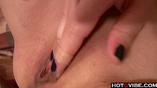 redhead enjoys solo fun in bed