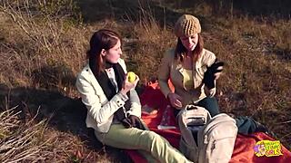 an outdoor picnic between two brunette friends quickly turns into lesbian sex with a strapon