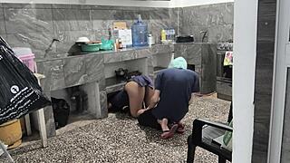 My stepsister got stuck in the kitchen while cleaning, I helped her and filmed her brown buttocks