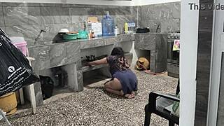 My stepsister got stuck in the kitchen while cleaning, I helped her and filmed her brown buttocks