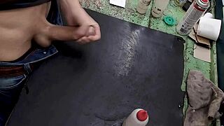 skinny young amateur masturbates big cock on workbench at work