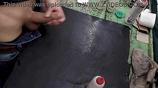 skinny young amateur masturbates big cock on workbench at work