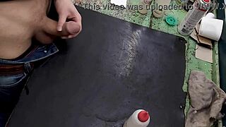 skinny young amateur masturbates big cock on workbench at work