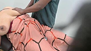 An indian doctor checks a lady patient in the clinic