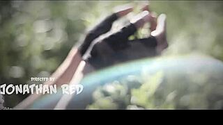 Sexy model poses topless in outdoor photoshoot