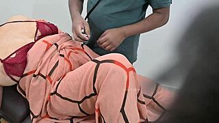An indian doctor checks a lady patient in the clinic