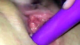 The lesbian wet wife masturbates casually in her room