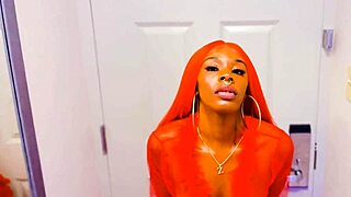 stunning ebony redhead reveals her impressive dildo skills during a solo masturbation session