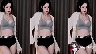 Wow, this Korean babe gives a sexy blowjob while dancing on webcam