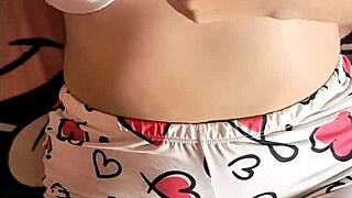 Colombian girl gets aroused watching a porn video on her bed