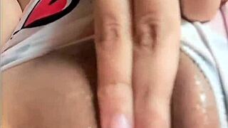 Colombian girl gets aroused watching a porn video on her bed