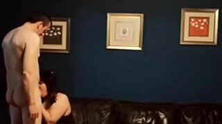 that mature mom is giving a sloppy blowjob to her stepson in the kitchen