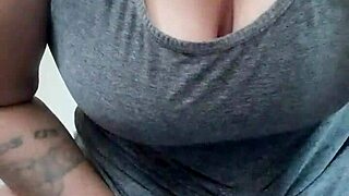 thekinkyfuckers tattooed brunette fucks dildo with her titties!