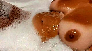 Tanned Stepsister's Big Tits Tease In Bathroom