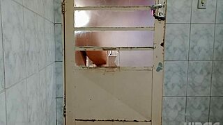 Fascinating Crossdresser Teases Behind Door with Seductive Hip Shakes