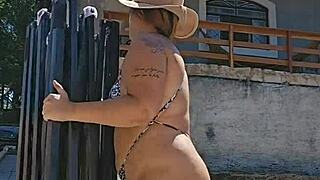 young wife flashes huge ass in tight bodysuit by pool as husband watches silently