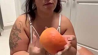 curvy bbw tattooed beauty teases fat ass with fruit fetish