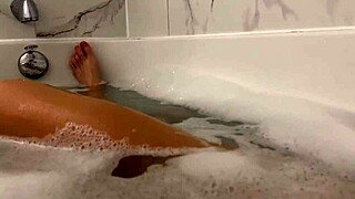 Petite Brunette Moans Wildly in Steamy Shower Orgasm