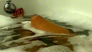 Petite Brunette Moans Wildly in Steamy Shower Orgasm