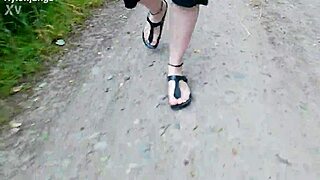 german chubby walks barefoot in birkenstocks through nature outdoors