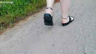 german chubby walks barefoot in birkenstocks through nature outdoors