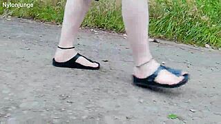german chubby walks barefoot in birkenstocks through nature outdoors