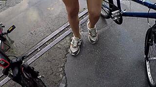 Two hot babes pedal no-panties in rain, voyeur tits bouncing wild!