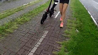 Two hot babes pedal no-panties in rain, voyeur tits bouncing wild!