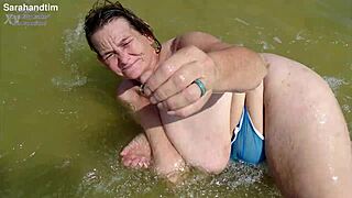 granny's huge saggy beach tits bounce in see-through top closeup