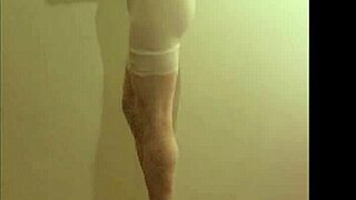 crossdresser maria struts in see-through white nylon panties high heels leggings and miniskirt for foot fetish tease