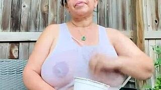 wet shirt clings to massive tits