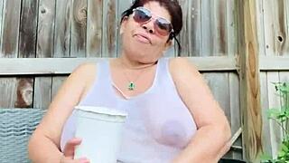 wet shirt clings to massive tits