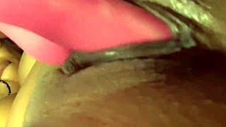 Vibrator teases ebony depths intimately