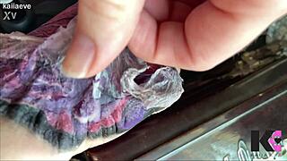 Fresh tattoo glistens on babe's skin in slow motion peel