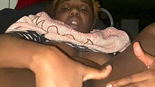 Ebony babe fingers her creamy pussy with saggy tits bouncing