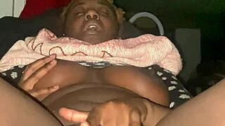 Ebony babe fingers her creamy pussy with saggy tits bouncing