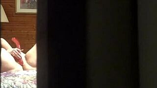 Peeping tom spies amateur milf fingering pussy at hotel