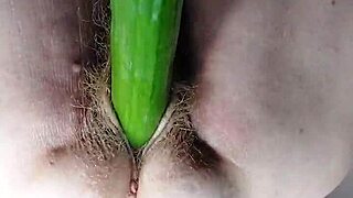 Granny Shoves Dildo Cucumber into Hairy Pussy
