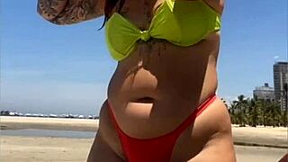 hey look at this married woman flashing her stuff on the beach to grab all the attention!!