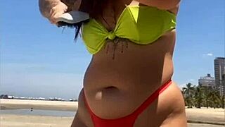 hey look at this married woman flashing her stuff on the beach to grab all the attention!!