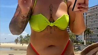 hey look at this married woman flashing her stuff on the beach to grab all the attention!!